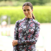 Rider wears the Shires Aubrion React Long Sleeve Base Layer in Abstract